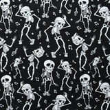 Coton imprimé Squelettes Rock’n’Roll blanc fond noir