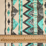 Suede jersey with embroidered base in water green and gray sequin, sand background