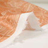 Coton imprimé palmier fond orange brûlé