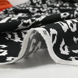 Lin viscose imprimé léopard féroce fond noir