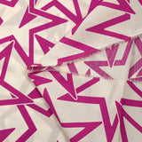 Star printed cotton poplin in magenta off-white background