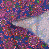 Velours de coton côtelé imprimé fleurs psychédéliques fond indigo
