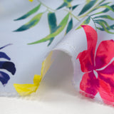Popeline de coton imprimée fleurs tropicales fond bleu ciel