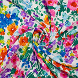 Crépon viscose lurex imprimé fleurs rose, vert et jaune fond blanc