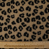 Fausse fourrure sherpa léopard noir fond marron