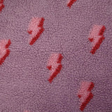 Fausse fourrure sherpa éclairs fond lilas