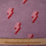 Fausse fourrure sherpa éclairs fond lilas