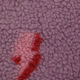 Fausse fourrure sherpa éclairs fond lilas