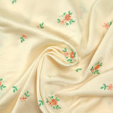 Polyester satin embroidered peach flowers ivory background