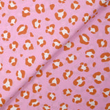 Algodón estampado leopardo fondo rosa naranja quemado