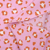 Algodón estampado leopardo fondo rosa naranja quemado