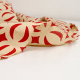 Coton imprimé parenthèse rouge fond beige