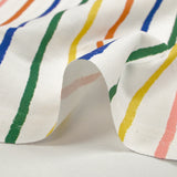 Coton imprimé rayures colorées fond blanc cassé