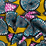 Coton imprimé ethnique Almere bleu et fuchsia fond ocre