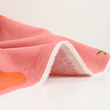 Velours de coton côtelé imprimé poire orange fond rose
