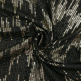 Maille fine polyester effet sequin en chevron doré fond noir
