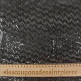 Maille Lurex polyester à paillettes argentées rayées fond noir
