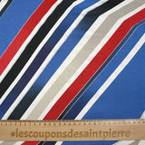 Jersey de viscose imprimé diagonales et paillettes fond bleu