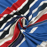 Jersey de viscose imprimé diagonales et paillettes fond bleu