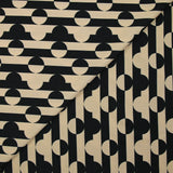 Punto crepé estampado rayas círculos negro y beige