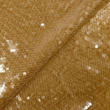 Sequins sur tulle résille ambre
