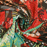 Maille crêpe imprimée ethnique rouge corail fond marron