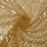 Sequins sur tulle résille ambre