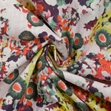 Coton fin imprimé primevère fond rose pâle