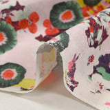 Coton fin imprimé primevère fond rose pâle