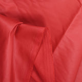 Sergé de coton élasthanne enduit rouge