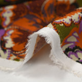 Twill de viscose imprimé fleurs paisley orange et violet fond kaki
