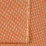 Coton imprimé pois 1mm fond terre de sienne
