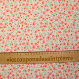 Viscose imprimée spirale de fleurs roses et orange fond écru