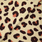 Faux leopard sherpa fur salmon and plum ecru background