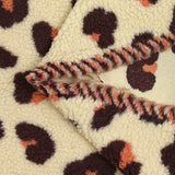 Faux leopard sherpa fur salmon and plum ecru background