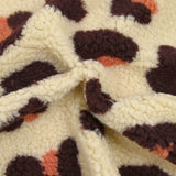 Faux leopard sherpa fur salmon and plum ecru background
