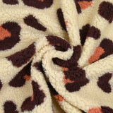 Faux leopard sherpa fur salmon and plum ecru background