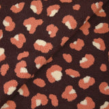 Salmon and ecru leopard faux sherpa fur, dark plum background