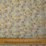 Mousseline nervurée imprimée fleurs rouge, bleu et jaune fond blanc