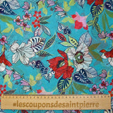 Mousseline imprimée fleurs exotiques rouge et blanc fond turquoise