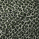 Mousseline imprimée plumetis velours léopard vert fond blanc