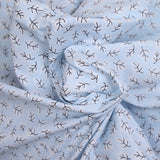 Popeline polycoton imprimée rayée et branche fond bleu