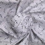 Popeline polycoton imprimée rayée et branche fond gris