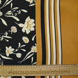 Twill de polyester satiné imprimé fleurs écrues et bordure ocre fond noir