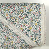 Cotton printed aurora flowers and yellow flowers white background per meter