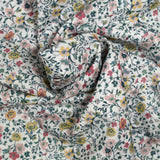 Cotton printed aurora flowers and yellow flowers white background per meter