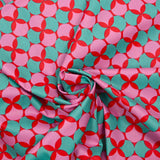 Popeline enduite imprimée pois & trèfle vert fond rouge