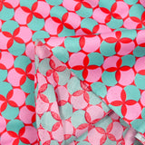 Popeline enduite imprimée pois & trèfle vert fond rouge