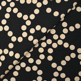 Crêpe viscose imprimé à pois beige fond noir