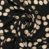 Crêpe viscose imprimé à pois beige fond noir